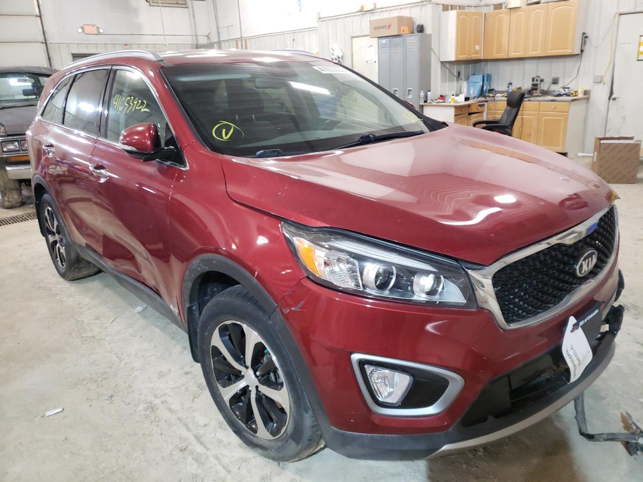 KIA SORENTO EX 2016 with VIN 5XYPHDA19GG017826 - Photo from auction