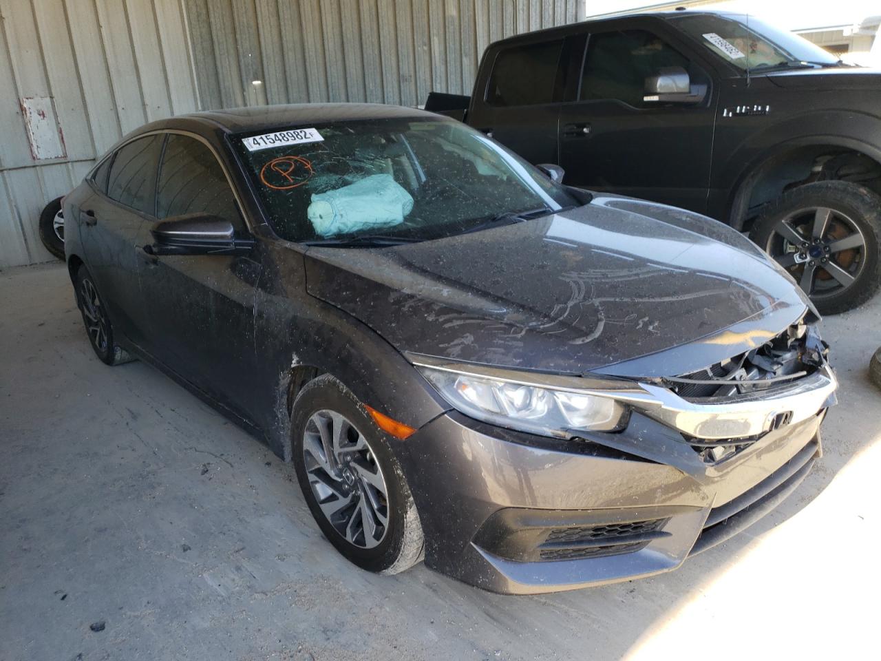 HONDA CIVIC EX 2018 with VIN 19XFC2F75JE020951 - Photo from auction