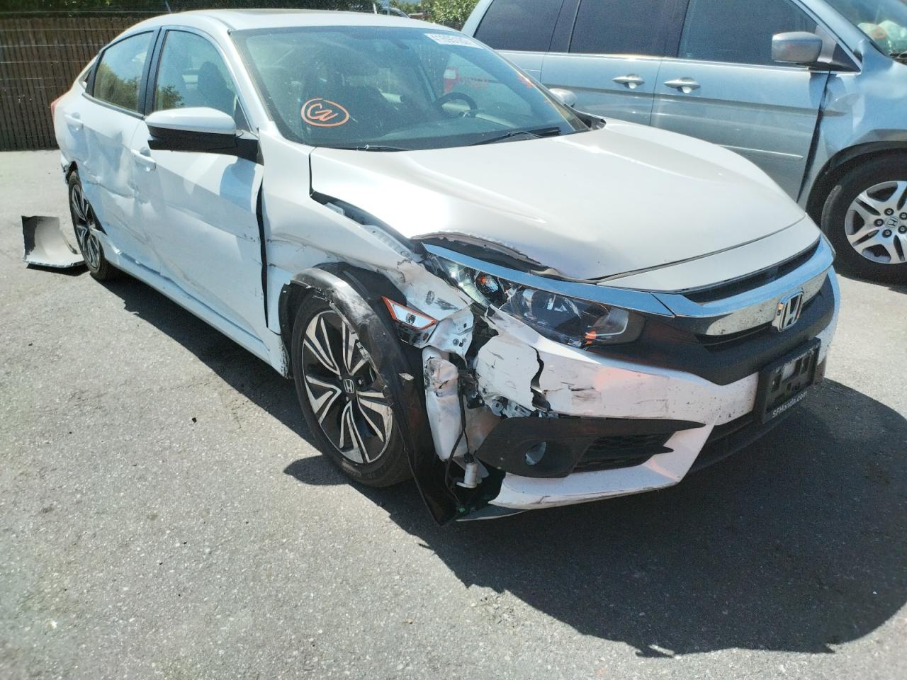 HONDA CIVIC EX 2018 with VIN JHMFC1F31JX020189 - Photo from auction
