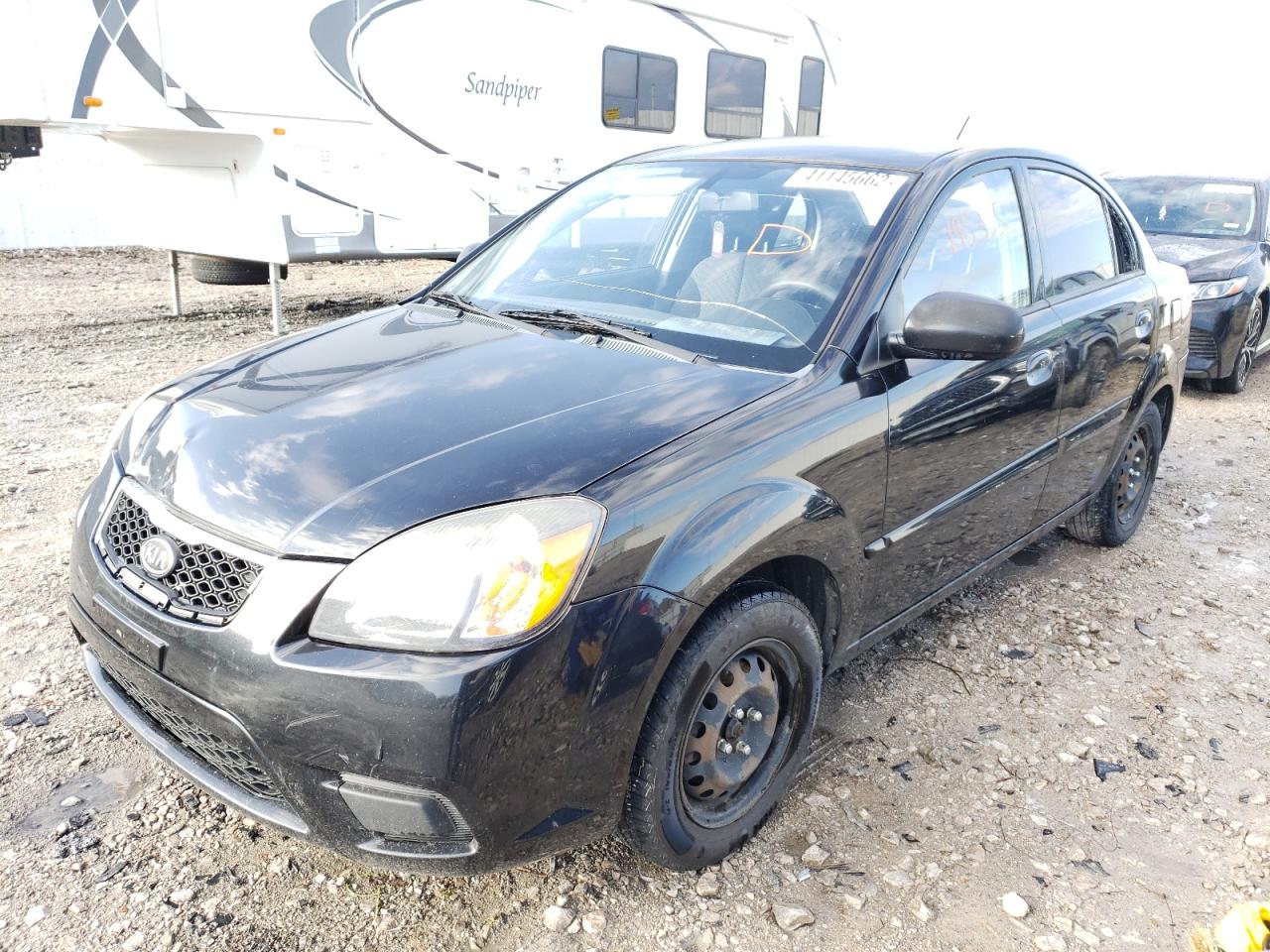 Photo 2 from auction – 2011 KIA RIO BASE with VIN KNADH4A3XB6857160