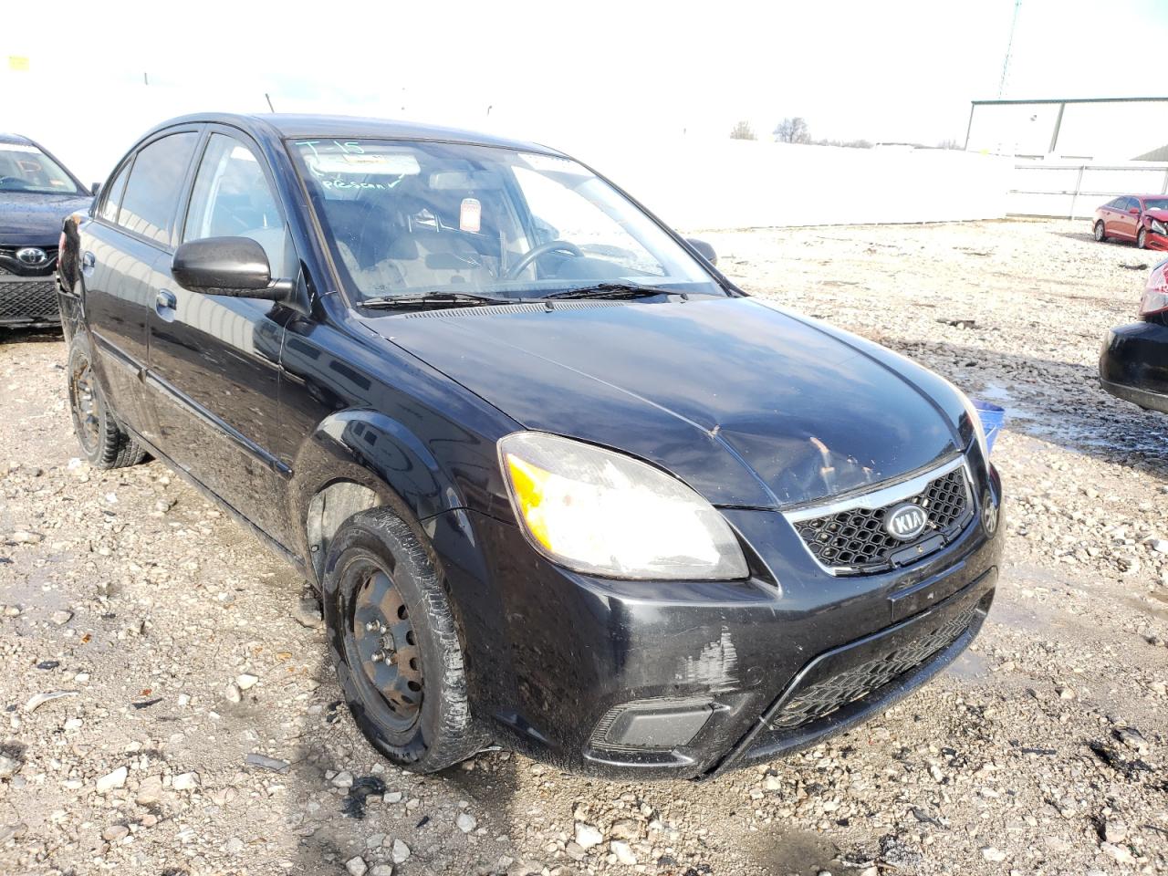 KIA RIO BASE 2011 with VIN KNADH4A3XB6857160 - Photo from auction