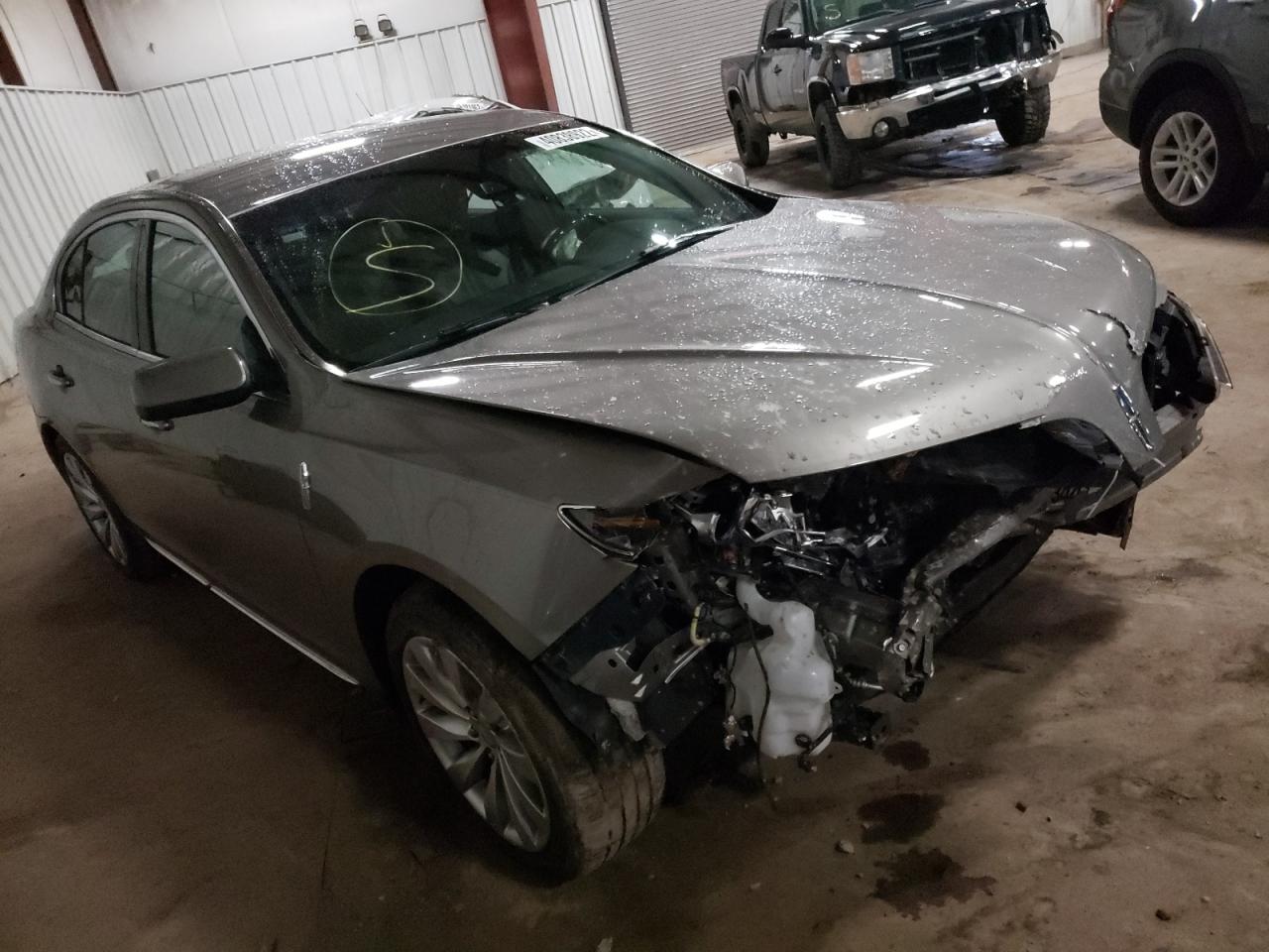 LINCOLN MKS 2015 with VIN 1LNHL9EK7FG600518 - Photo from auction