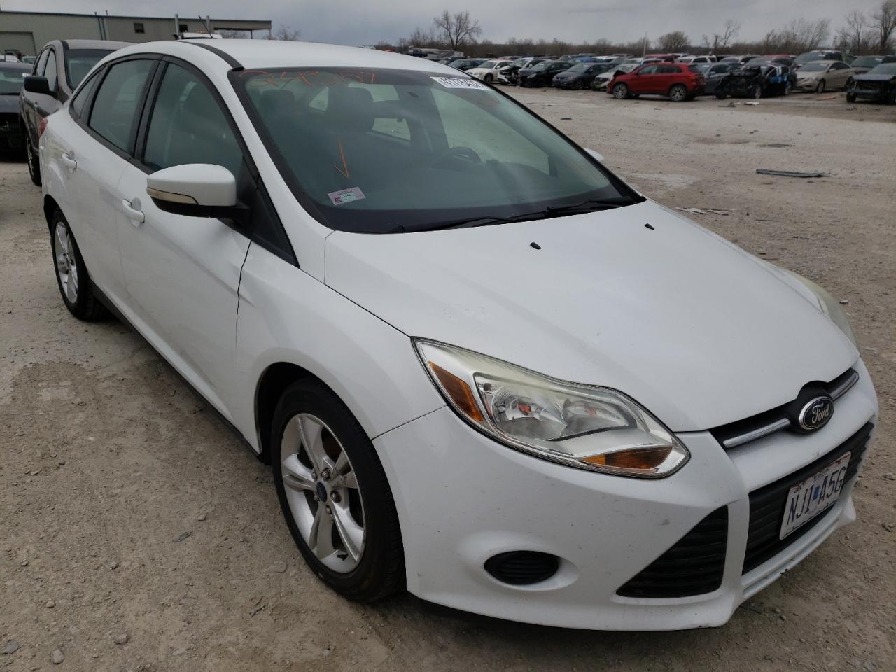 FORD FOCUS SE 2014 with VIN 1FADP3F23EL243157 - Photo from auction