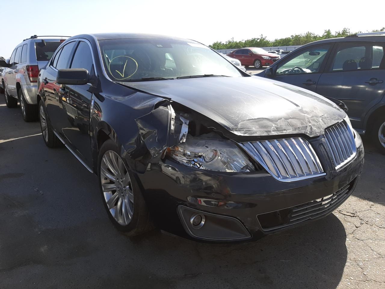 LINCOLN MKS 2009 with VIN 1LNHM94R39G620894 - Photo from auction