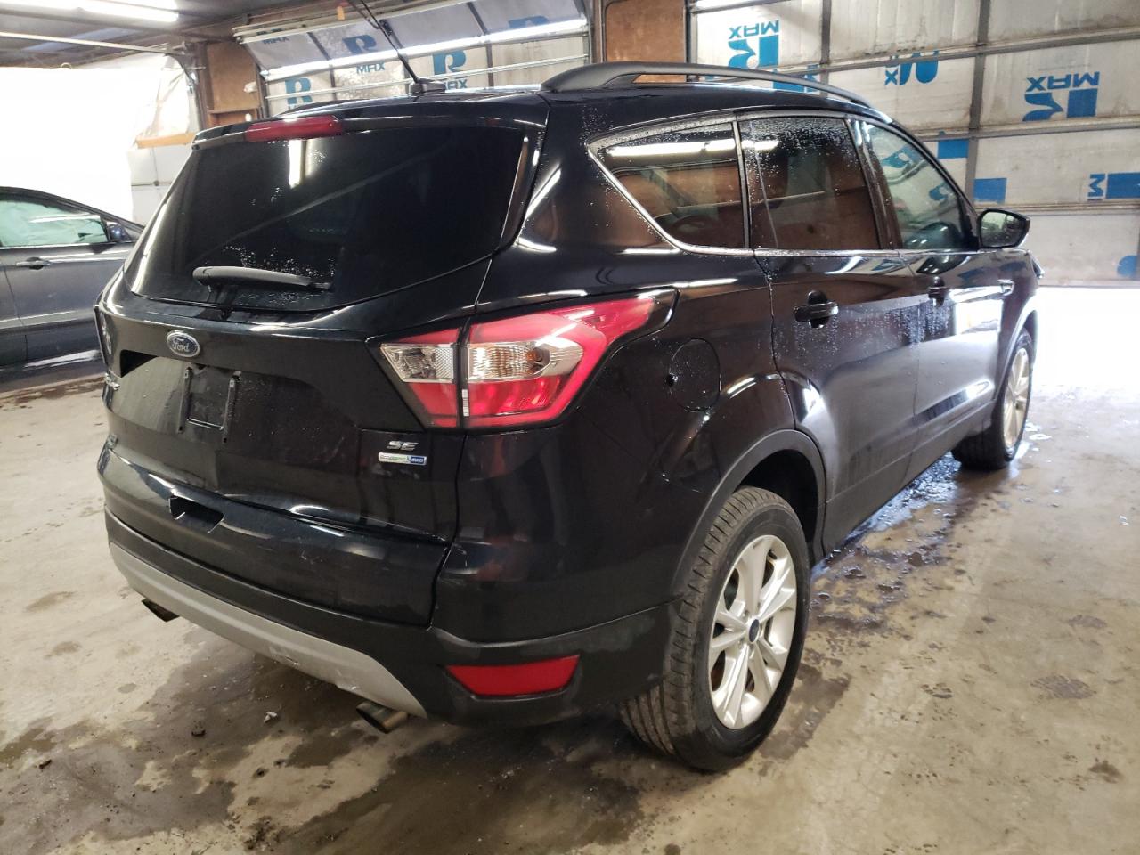 Photo 4 from auction – 2018 FORD ESCAPE SE with VIN 1FMCU9GD3JUA29206