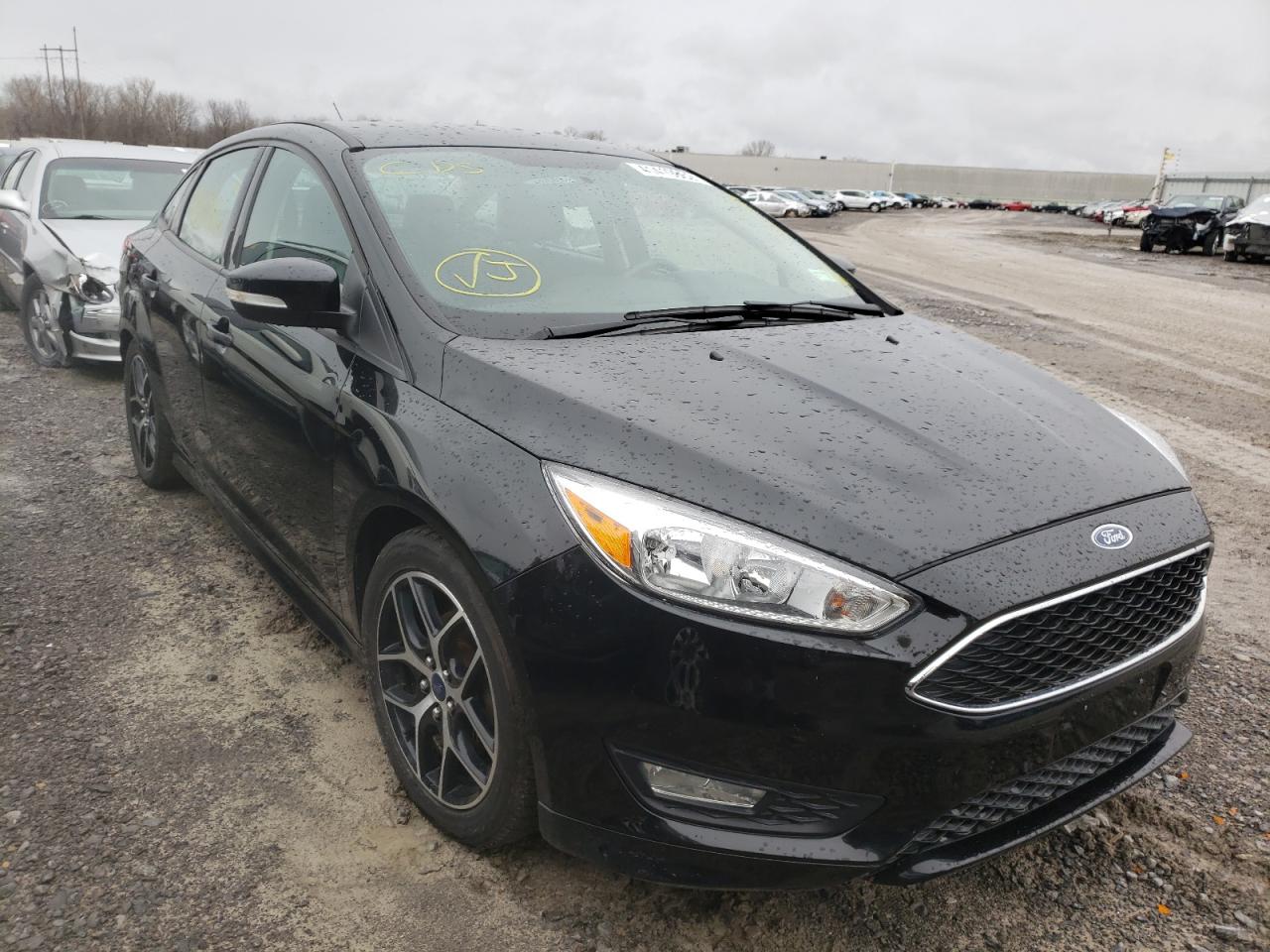 FORD FOCUS SE 2015 with VIN 1FADP3F20FL310721 - Photo from auction