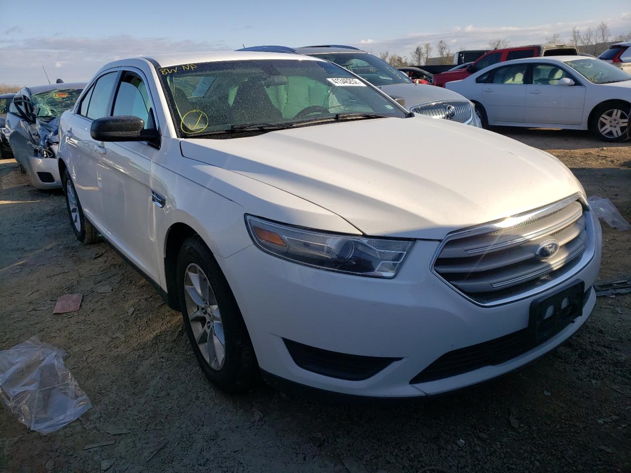 FORD TAURUS SE 2014 with VIN 1FAHP2D85EG123615 - Photo from auction