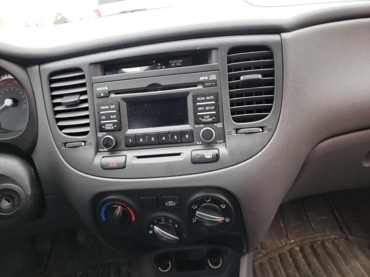 Photo 9 from auction – 2011 KIA RIO BASE with VIN KNADH4A37B6751345
