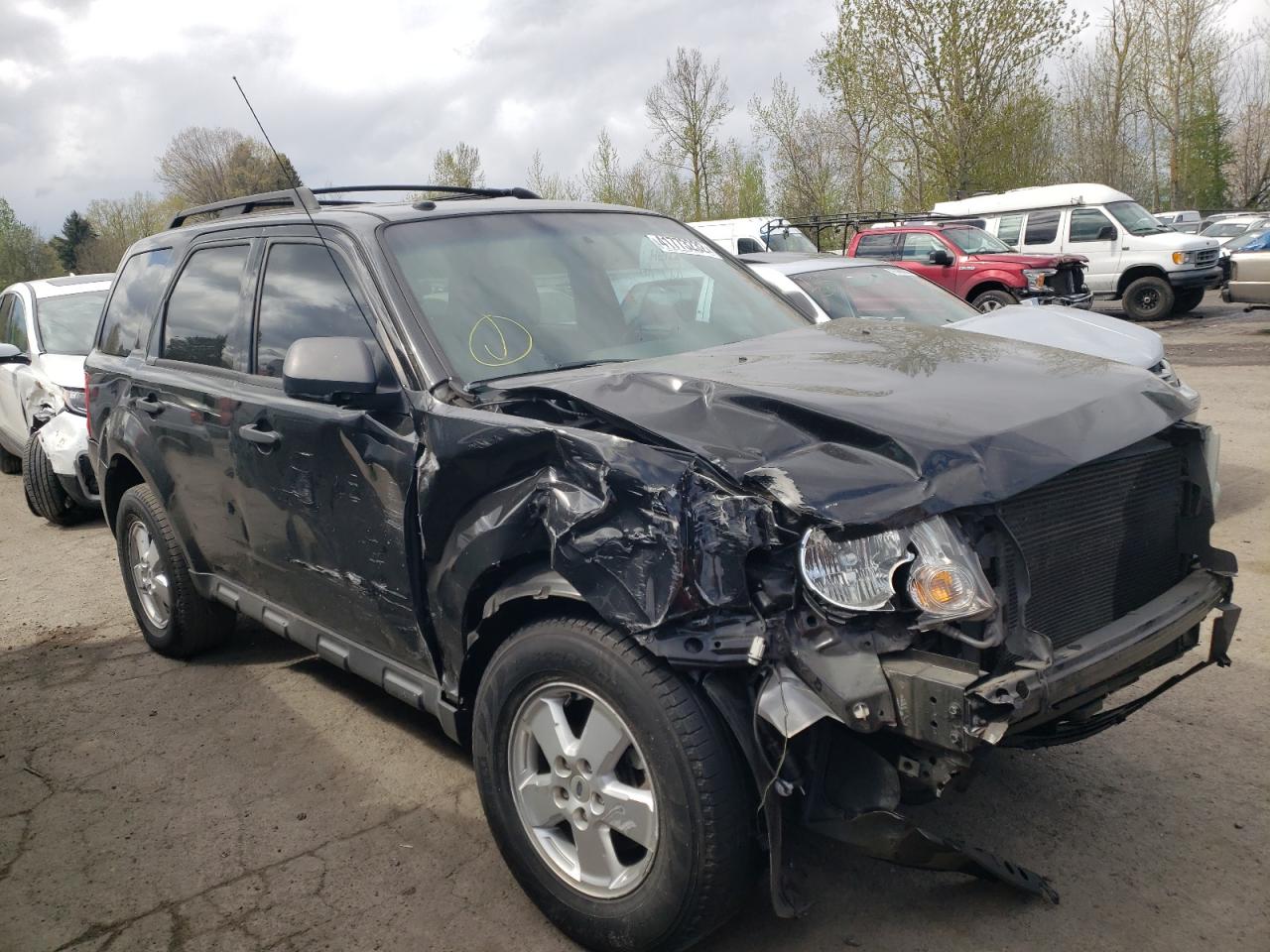 FORD ESCAPE XLT 2011 with VIN 1FMCU0DG7BKB90598 - Photo from auction