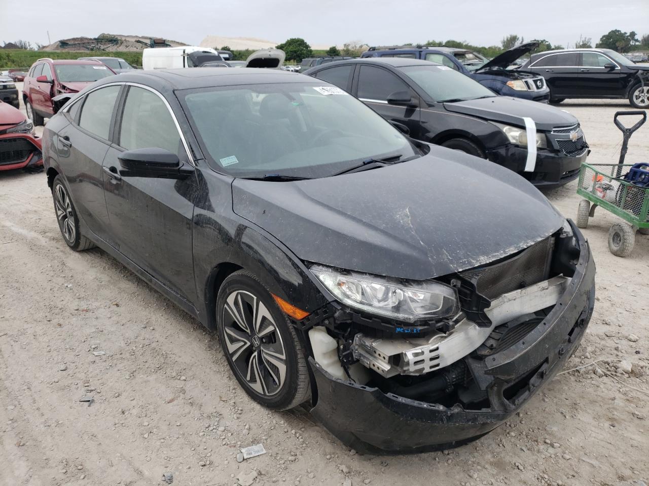 HONDA CIVIC EXL 2018 with VIN JHMFC1F78JX004753 - Photo from auction