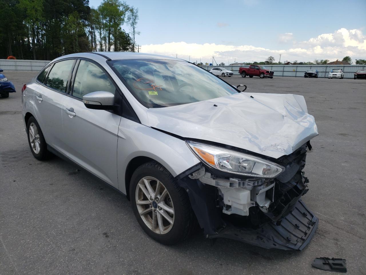 FORD FOCUS SE 2016 with VIN 1FADP3F25GL390129 - Photo from auction