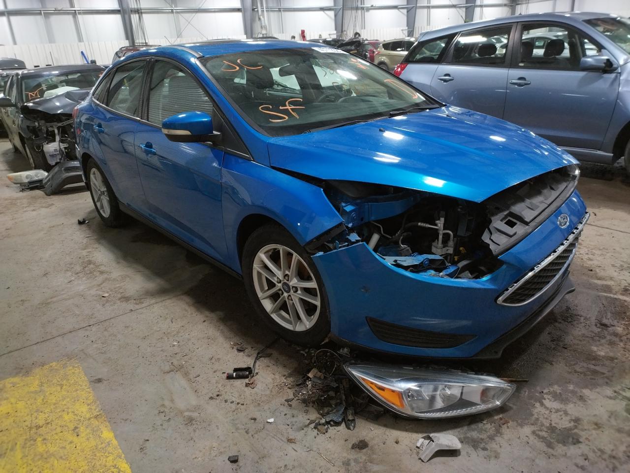 FORD FOCUS SE 2015 with VIN 1FADP3F29FL263799 - Photo from auction