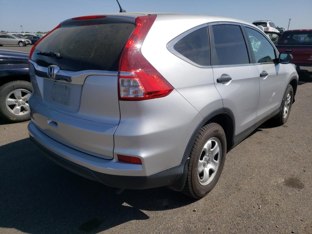 Photo 4 from auction – 2015 HONDA CR-V LX with VIN 5J6RM3H36FL002168