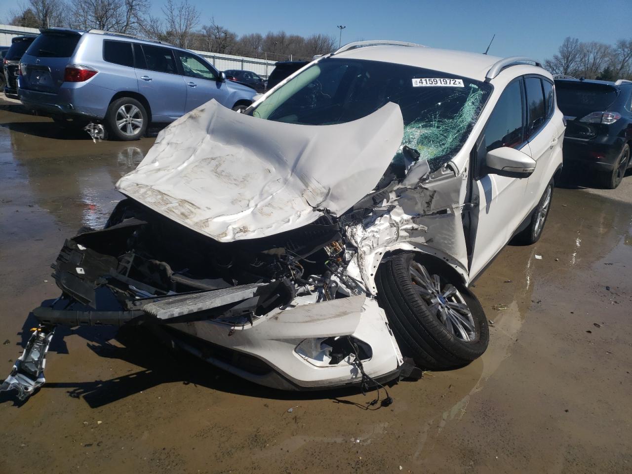 Photo 2 from auction – 2017 FORD ESCAPE TIT with VIN 1FMCU9J91HUB34454