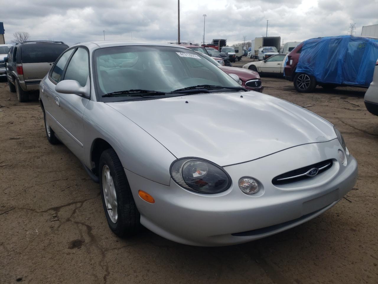 FORD TAURUS SE 1999 with VIN 1FAFP53UXXG165238 - Photo from auction