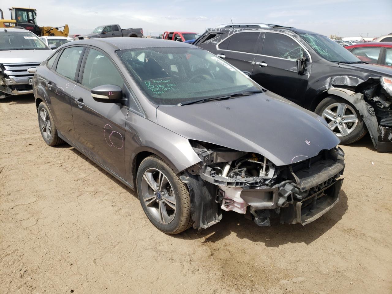 FORD FOCUS SE 2014 with VIN 1FADP3F20EL320101 - Photo from auction