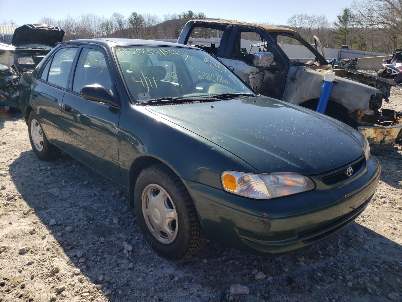 TOYOTA COROLLA VE 2000 with VIN 2T1BR12E9YC297008 - Photo from auction