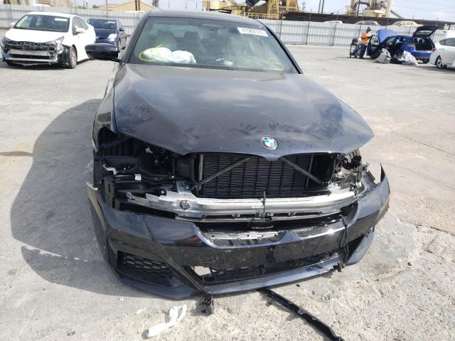 Photo 9 from auction – 2022 BMW M550XI with VIN WBA13BK06NCJ38326