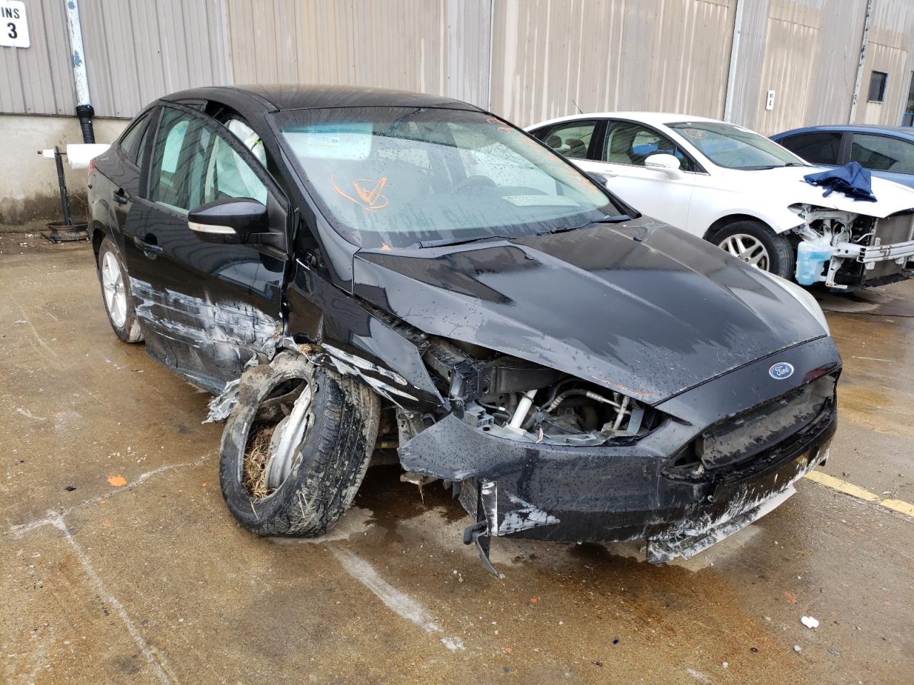 FORD FOCUS SE 2015 with VIN 1FADP3F22FL259433 - Photo from auction