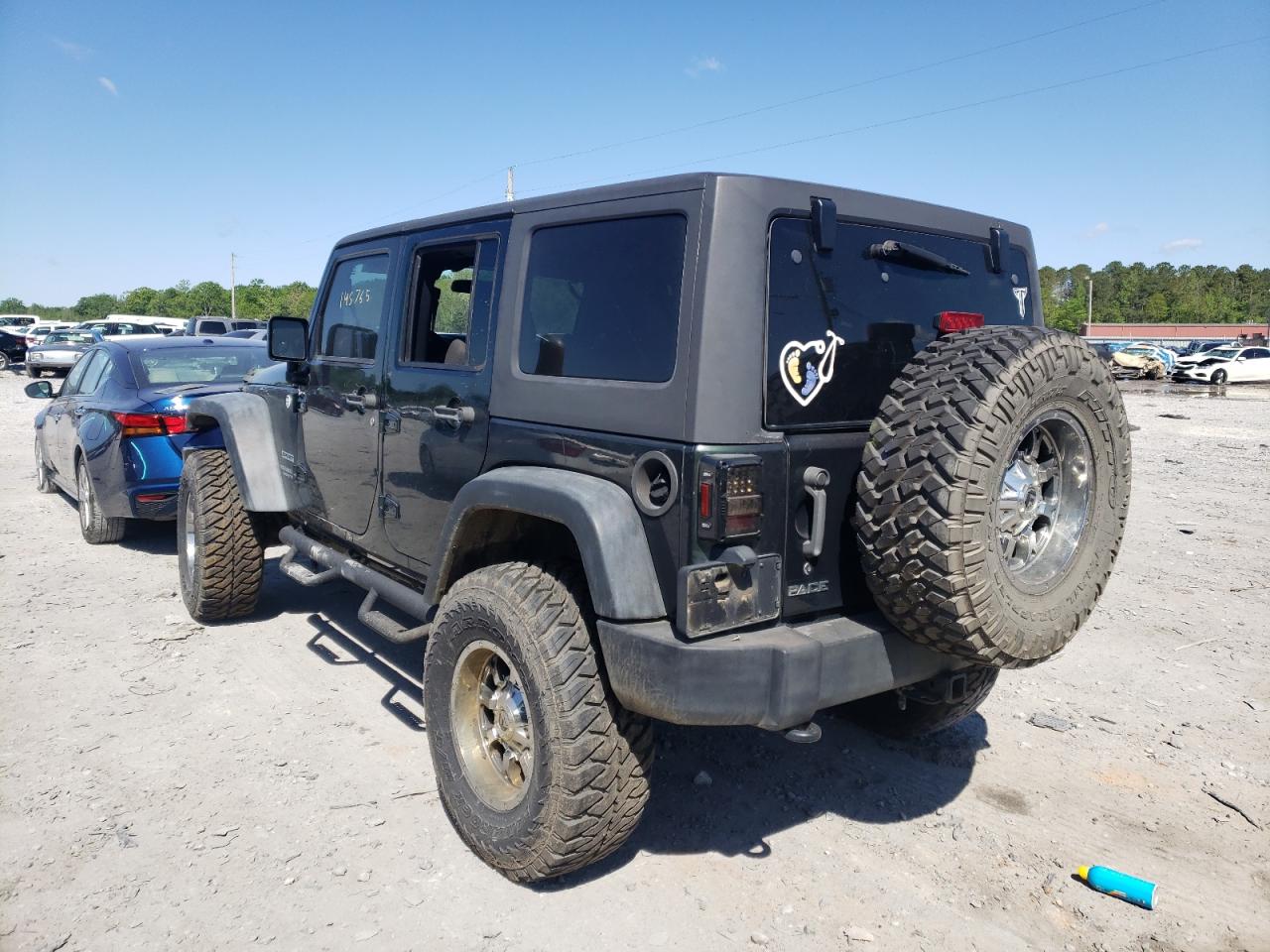 Photo 3 from auction – 2012 JEEP WRANGLER U with VIN 1C4BJWDG5CL118287