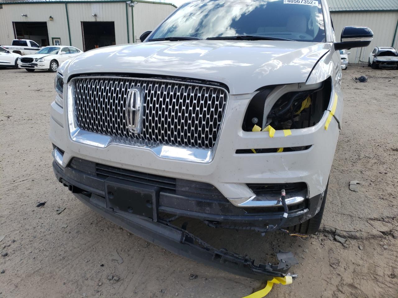 Photo 9 from auction – 2021 LINCOLN NAVIGATOR with VIN 5LMJJ2LT7MEL06830