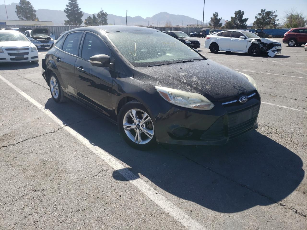 FORD FOCUS SE 2014 with VIN 1FADP3F24EL130415 - Photo from auction
