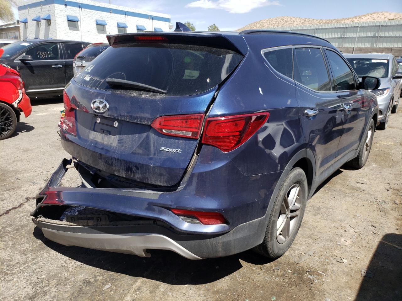Photo 4 from auction – 2017 HYUNDAI SANTA FE S with VIN 5XYZU3LBXHG463554