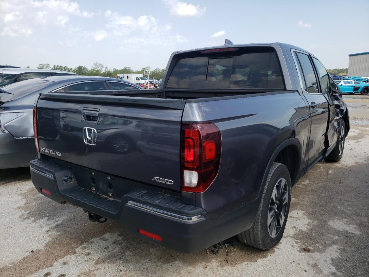 Photo 4 from auction – 2020 HONDA RIDGELINE with VIN 5FPYK3F59LB019872