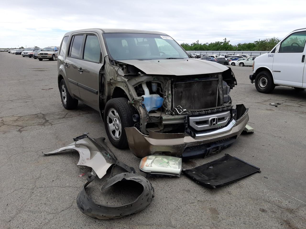 HONDA PILOT LX 2011 with VIN 5FNYF3H21BB037569 - Photo from auction