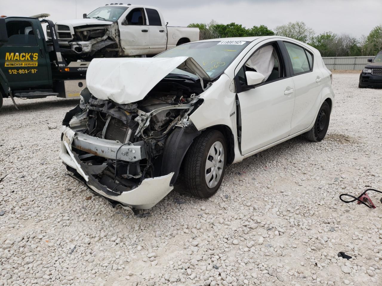 Photo 2 from auction – 2014 TOYOTA PRIUS C with VIN JTDKDTB34E1062265