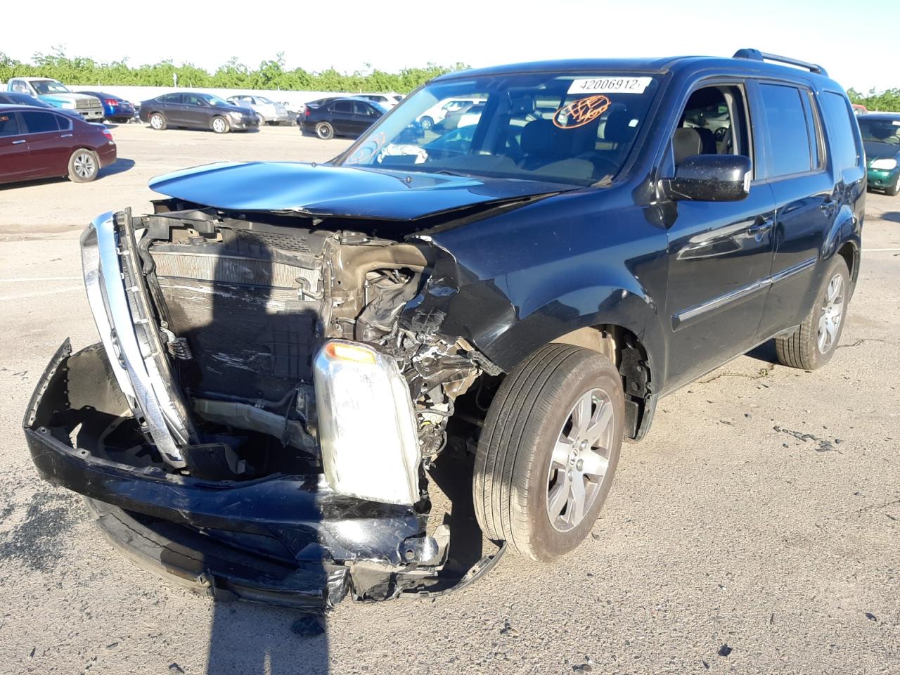 Photo 2 from auction – 2014 HONDA PILOT TOUR with VIN 5FNYF4H92EB035174