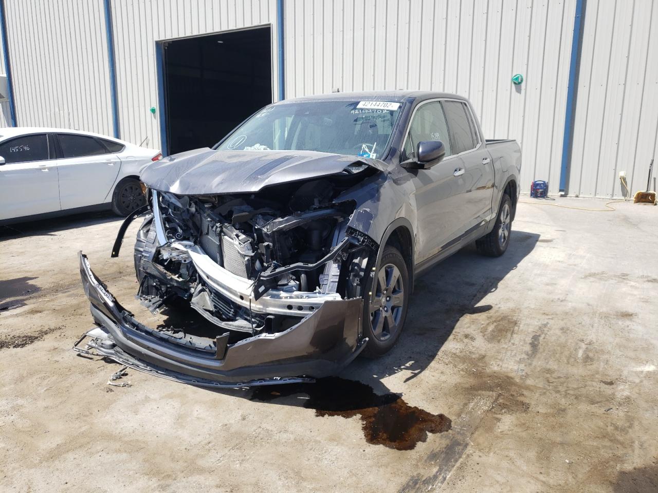 Photo 2 from auction – 2020 HONDA RIDGELINE with VIN 5FPYK3F70LB006445