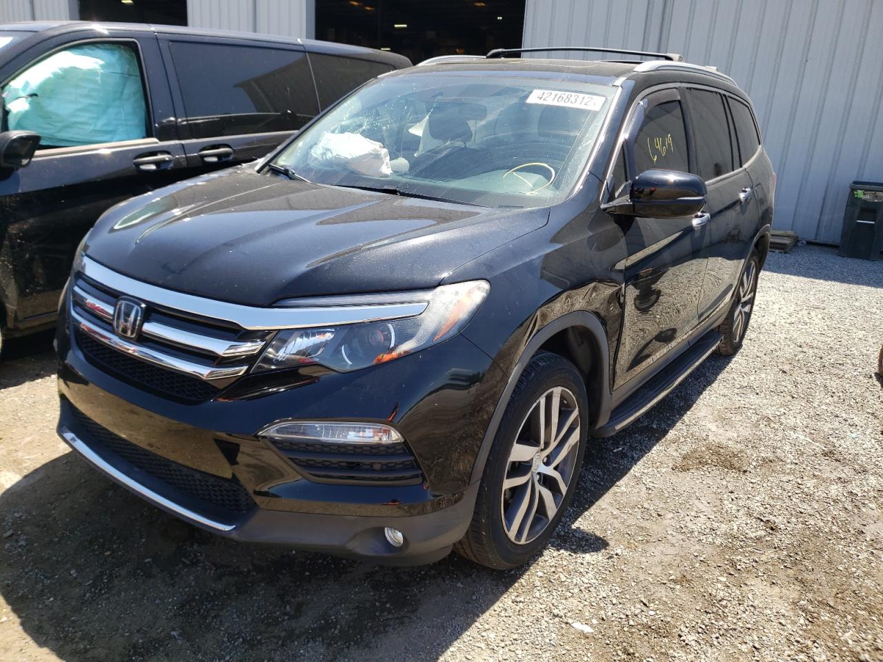 Photo 2 from auction – 2017 HONDA PILOT TOUR with VIN 5FNYF6H93HB022384