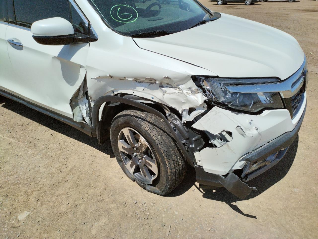 Photo 9 from auction – 2019 HONDA RIDGELINE with VIN 5FPYK3F73KB025540