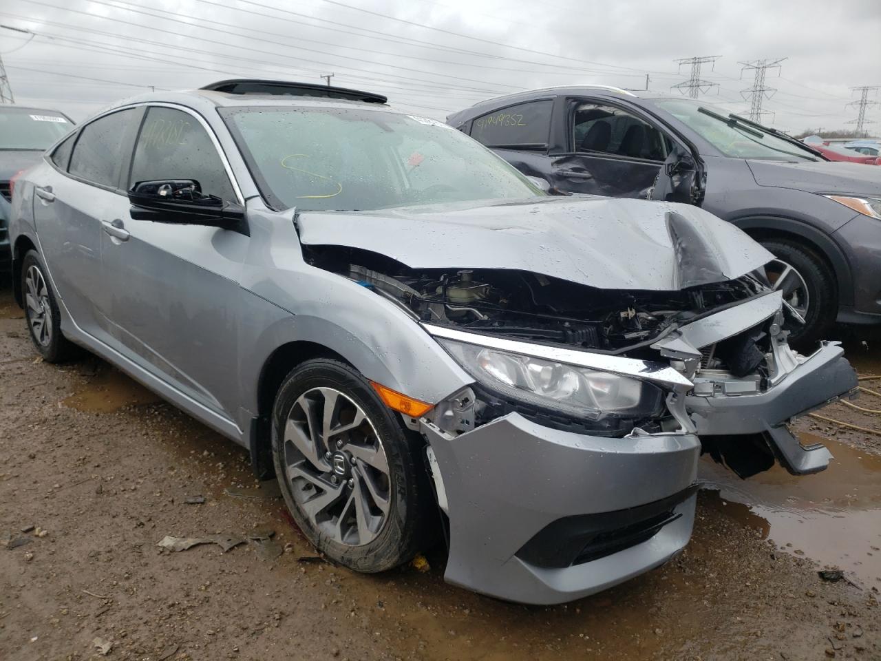 HONDA CIVIC EX 2018 with VIN 19XFC2F75JE027494 - Photo from auction