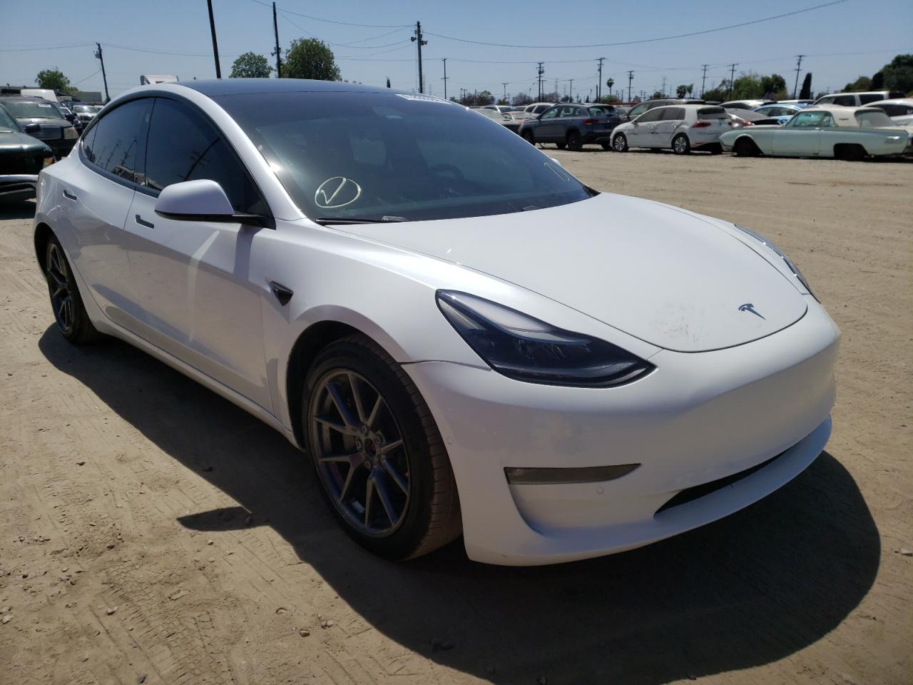 TESLA MODEL 3 2021 with VIN 5YJ3E1EB7MF869653 - Photo from auction
