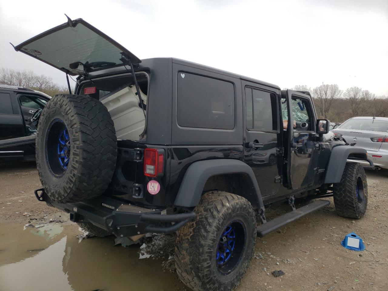 Photo 4 from auction – 2014 JEEP WRANGLER U with VIN 1C4HJWFG0EL160179