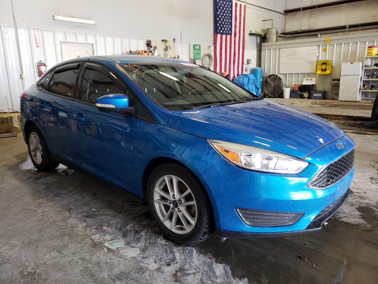 FORD FOCUS SE 2017 with VIN 1FADP3F29HL203055 - Photo from auction