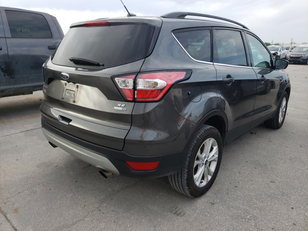 Photo 4 from auction – 2018 FORD ESCAPE SE with VIN 1FMCU9GD0JUC46986
