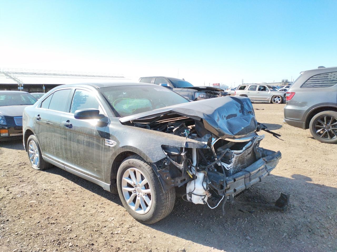 FORD TAURUS SE 2014 with VIN 1FAHP2D8XEG119723 - Photo from auction