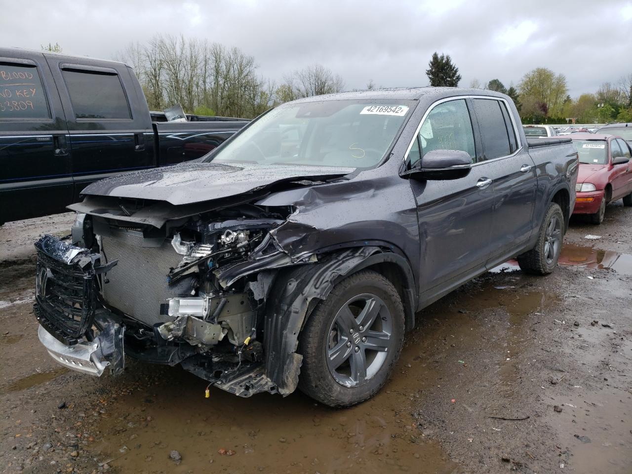 Photo 2 from auction – 2021 HONDA RIDGELINE with VIN 5FPYK3F76MB023123