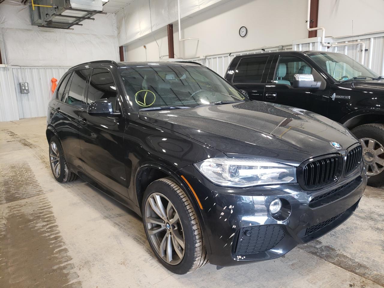 BMW X5 XDRIVE3 2015 with VIN 5UXKS4C50F0N09384 - Photo from auction