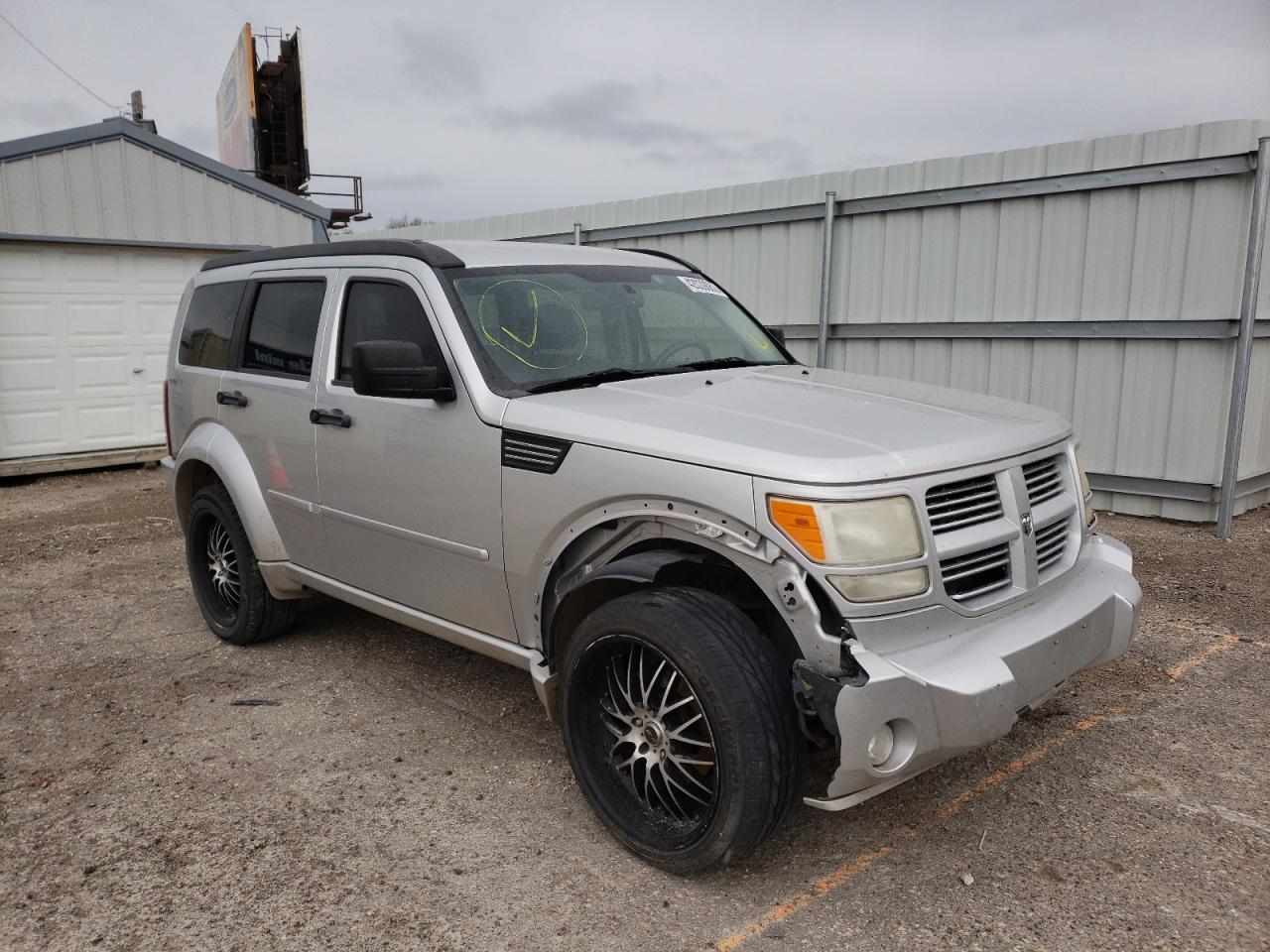 DODGE NITRO SXT 2011 with VIN 1D4PU5GK0BW574057 - Photo from auction