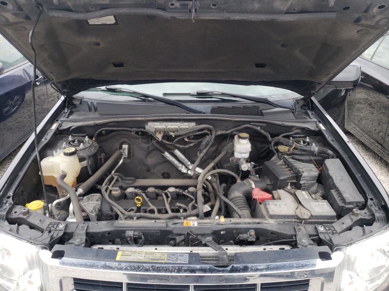 Photo 7 from auction – 2009 FORD ESCAPE LIM with VIN 1FMCU04709KD08842
