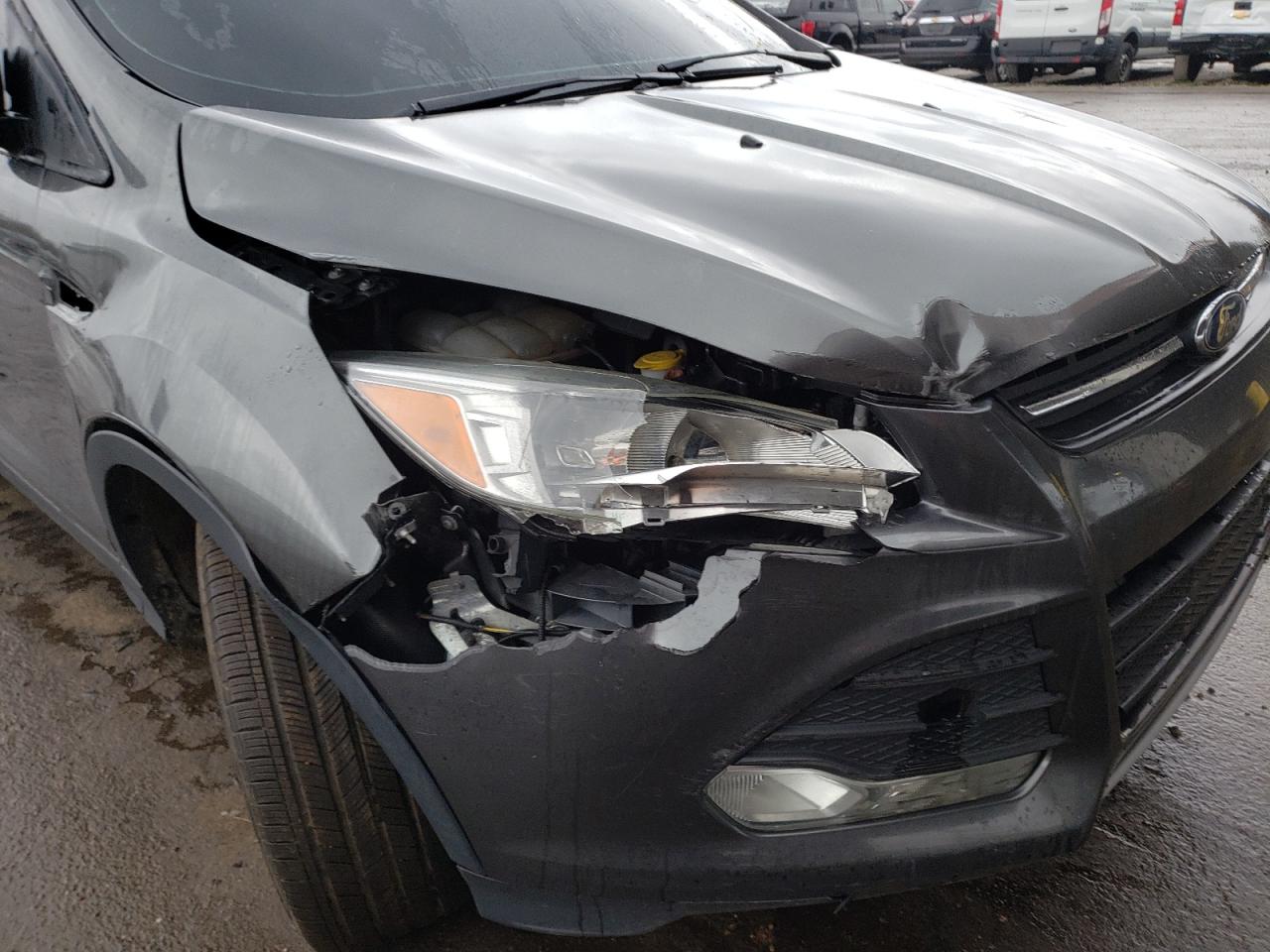 Photo 9 from auction – 2016 FORD ESCAPE SE with VIN 1FMCU9GX7GUA41684