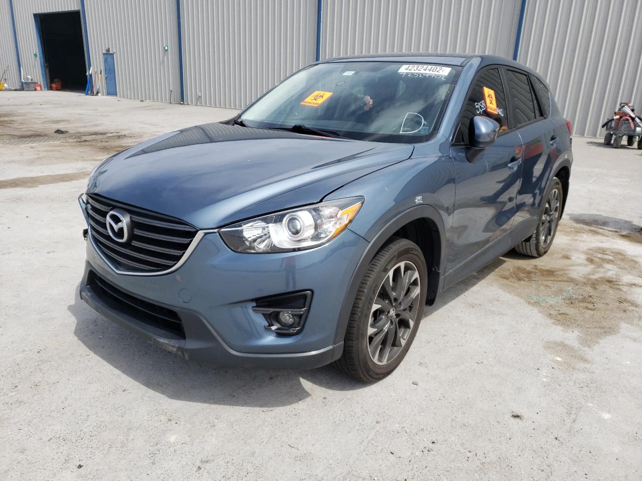 Photo 2 from auction – 2016 MAZDA CX-5 GT with VIN JM3KE2DY7G0858301