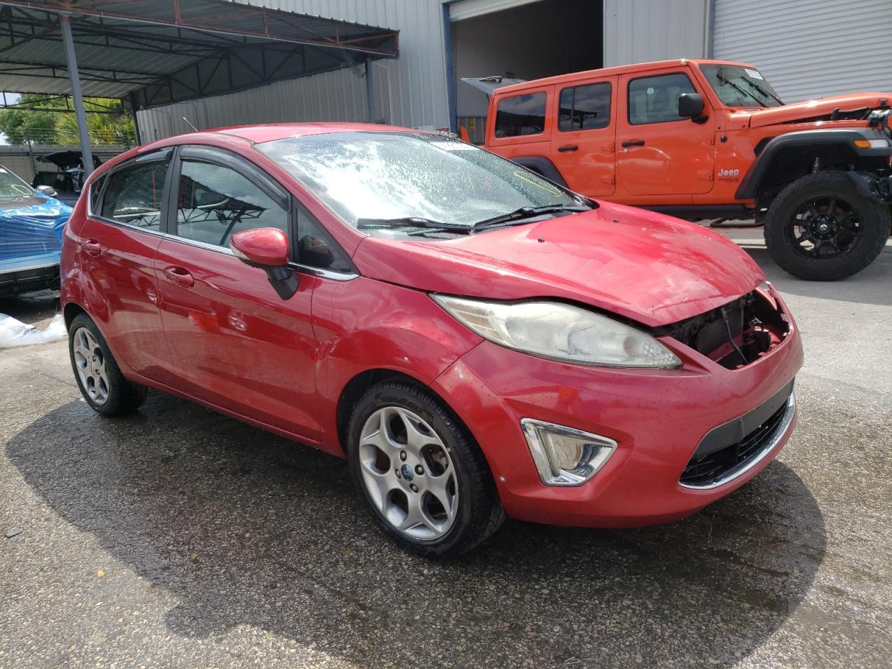 FORD FIESTA SES 2011 with VIN 3FADP4FJ0BM174841 - Photo from auction
