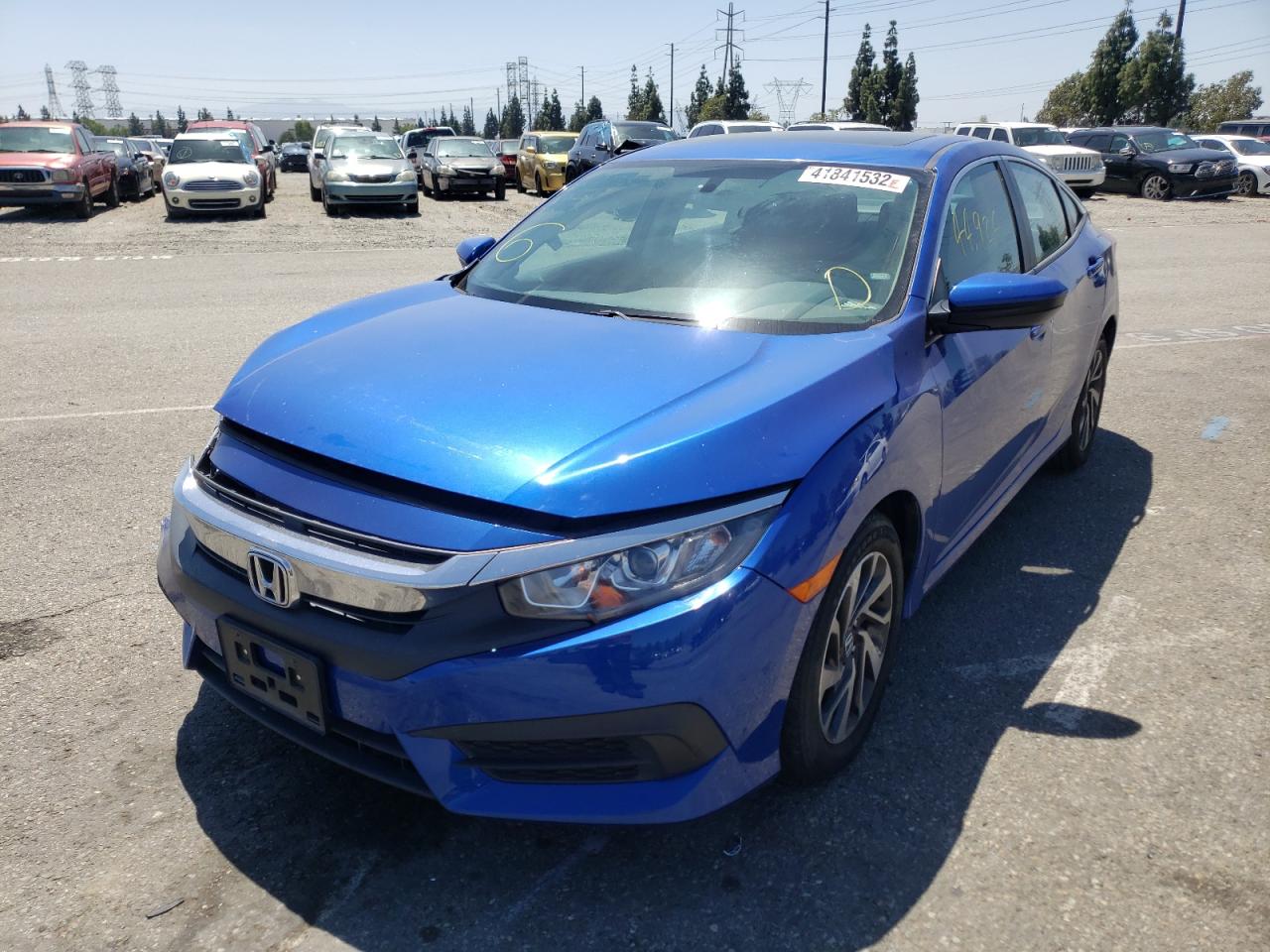 Photo 2 from auction – 2017 HONDA CIVIC EX with VIN 2HGFC2F70HH569229