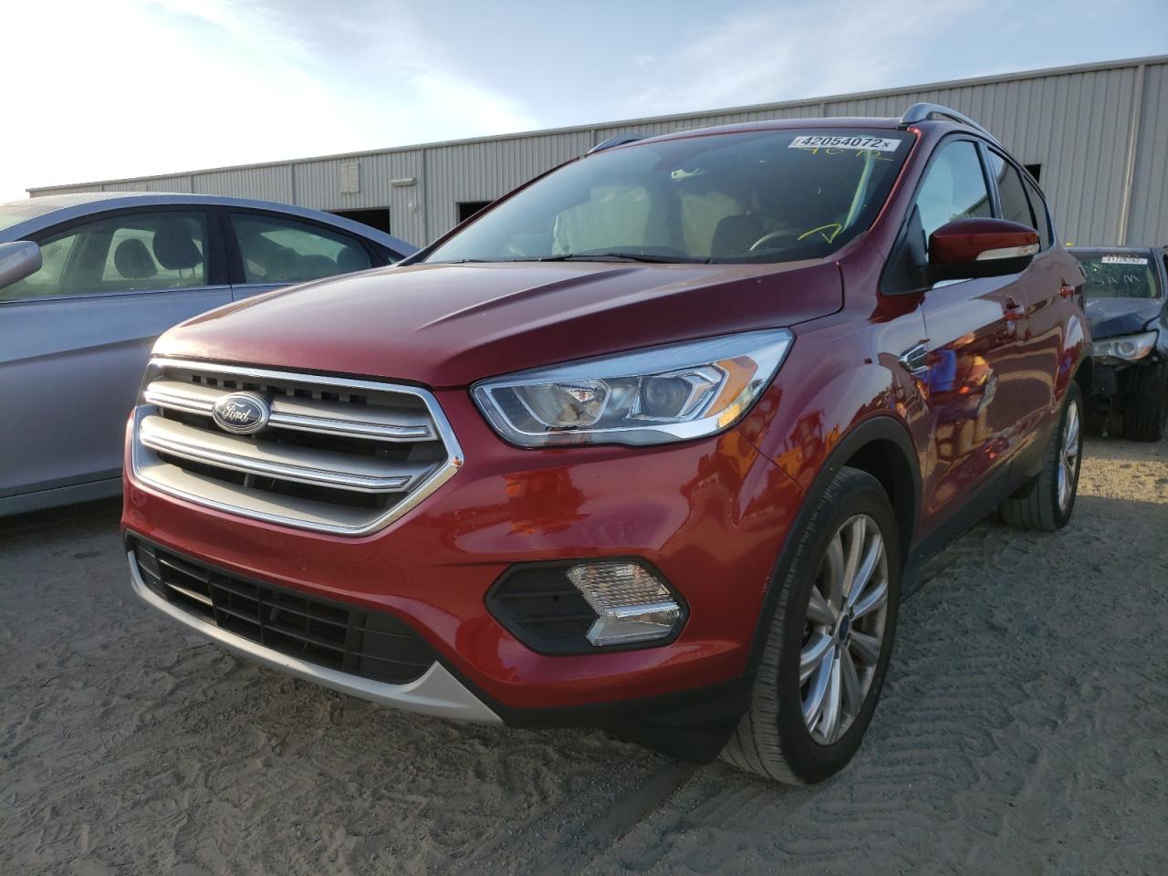 Photo 2 from auction – 2017 FORD ESCAPE TIT with VIN 1FMCU0J98HUB12334