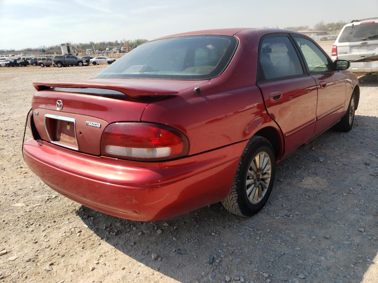 Photo 4 from auction – 1998 MAZDA 626 DX with VIN 1YVGF22C0W5704978